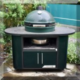L01. XL Big Green Egg grill. Stand measures 60”w, grill 26” w  